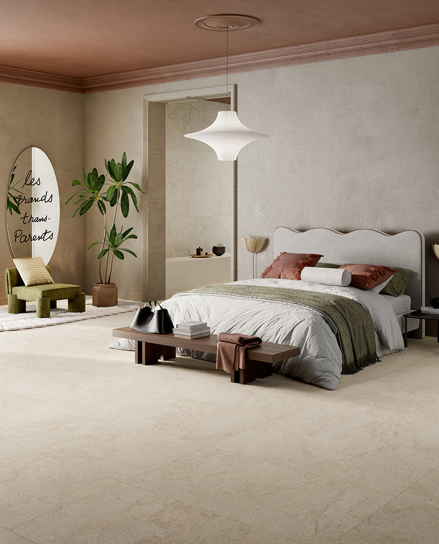 Slaapkamer met Cocooning Cashmere, warme textielkleuren en een houten bankje